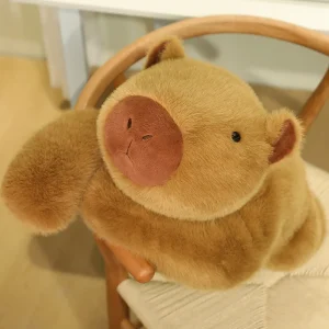 Viktat capybaragosedjur som mjuk plyschkudde med lång arm