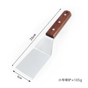 Stekspade i rostfritt stål med grillskrapa och trähandtag
