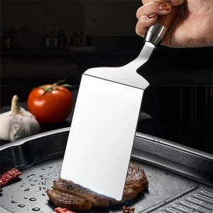 Stekspatel i rostfritt stål med trähandtag för kök och grill