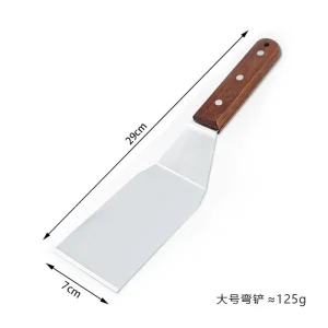 Stekspade i rostfritt stål med grillskrapa och trähandtag