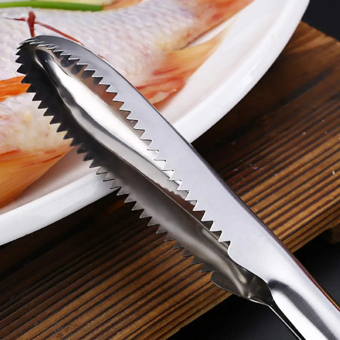 Fiskfjällssrapa i rostfritt stål med ergonomiskt handtag 6 Fiskfjällssrapa i rostfritt stål med ergonomiskt handtag - Bild 6