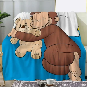 Curious George-blanket i coral fleece – mjuk, varm och lekfull