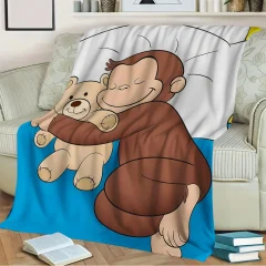 Curious George-blanket i coral fleece – mjuk, varm och lekfull