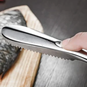 Fiskfjällssrapa i rostfritt stål med ergonomiskt handtag 12 Fiskfjällssrapa i rostfritt stål med ergonomiskt handtag