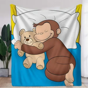 Curious George-blanket i coral fleece – mjuk, varm och lekfull
