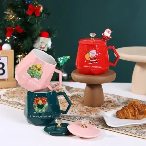 Alternative view of Julmugg i keramik med tomte, ren och snögubbe – handmålad