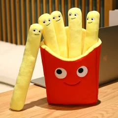 Flera figurvarianter av leende pommes frites som tröstande gosedjur och plyschkudde
