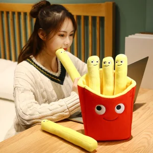 Flera figurvarianter av leende pommes frites som tröstande gosedjur och plyschkudde