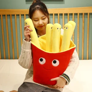 Flera figurvarianter av leende pommes frites som tröstande gosedjur och plyschkudde