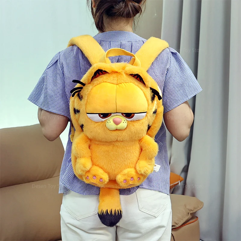 Garfield-familjens söta skolryggsäck av hög kvalitet för barn och vuxna, present 26 Närbild av Garfield-ryggsäcken med tecknade ansiktsdetaljer och stora ögon.