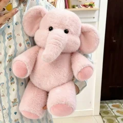 Elefant och tvättbjörn gosedjur som mjuk och fluffig plyschkudde för kramar