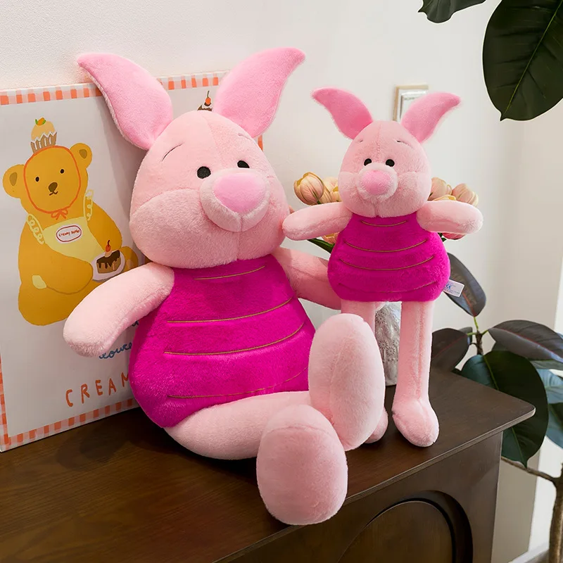 Piglet gosedjur som rosa plyschkudde med långa ben, söt tecknad stil, 55 cm 18 Visa de rosa grisgosedjuren i två olika storlekar och poser.