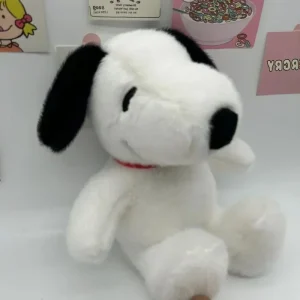 Kramvänlig hundkudde med Snoopy som gosedjur, i söt tecknad stil för soffans ryggstöd