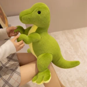Grönt dinosaurie gosedjur i triangelform med tyrannosaurus rex, drakmotiv och vråldesign