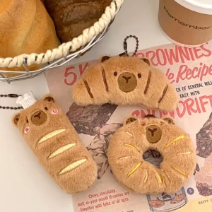 Kapybara- och delfinhängen i tecknad stil med bröd- och matmotiv samt kreativ design 15 Kapybara- och delfinhängen i tecknad stil med bröd- och matmotiv samt kreativ design