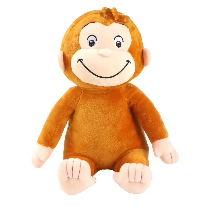 George från Curious George som apa gosedjur och mjuk följeslagardocka med bilderbok 26 Framifrånvisad orangebrun apdocka mot vit bakgrund.