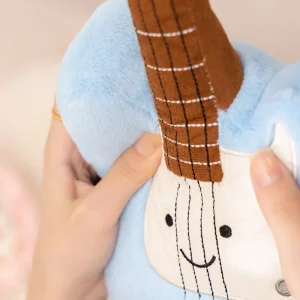 Söta gosedjur som instrumentkuddar: piano, saxofon, basgitarr, kinesisk cittra och pipa