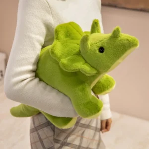 Grönt dinosaurie gosedjur i triangelform med tyrannosaurus rex, drakmotiv och vråldesign