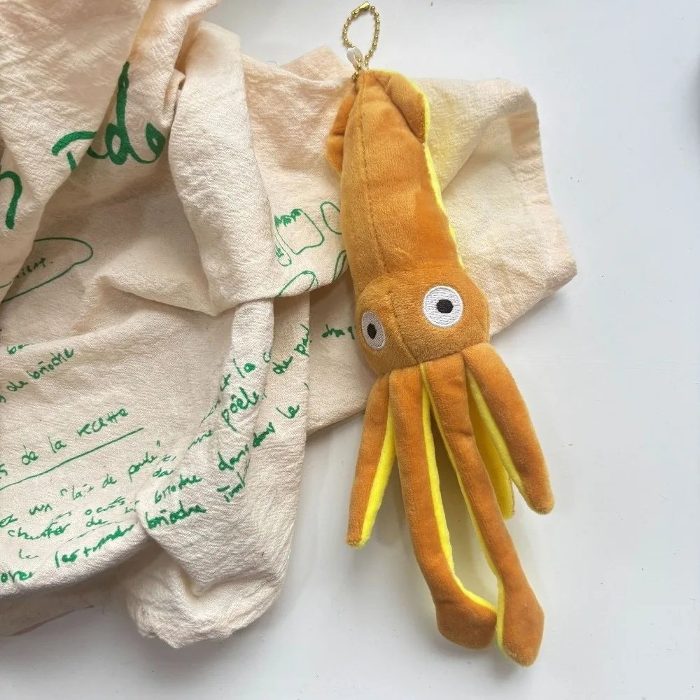 Bläckfisk som nyckelring, söt och Ocean series, squiddekoration tecknad style 22 Visa hela det orange bläckfiskhänget med gula detaljer.