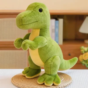 Grönt dinosaurie gosedjur i triangelform med tyrannosaurus rex, drakmotiv och vråldesign