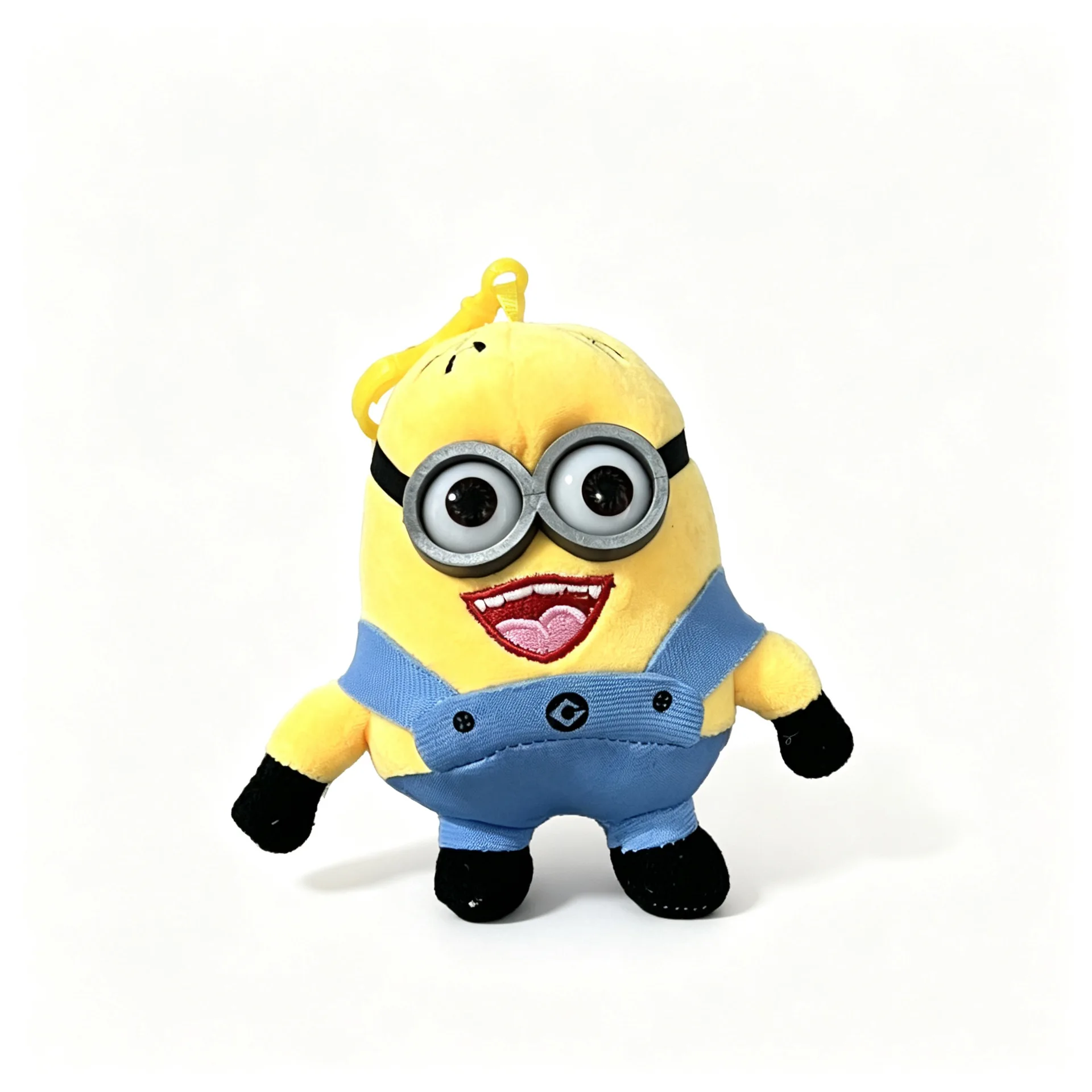 Minions tecknade figur som söt kawaii-nyckelring med hänge, liten present 28 En mjuk gul Minions-figur med blå detaljer på vit bakgrund.