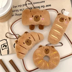 Kapybara- och delfinhängen i tecknad stil med bröd- och matmotiv samt kreativ design