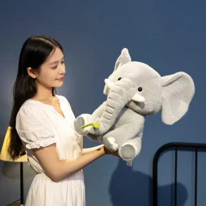 Sittande elefant gosedjur med lång snabel i tecknad stil, rosa eller grått, 25–40 cm