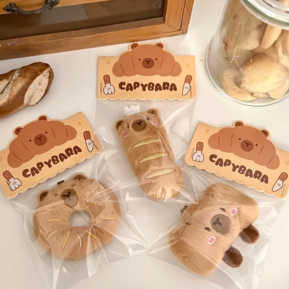 Kapybara- och delfinhängen i tecknad stil med bröd- och matmotiv samt kreativ design 4 Kapybara- och delfinhängen i tecknad stil med bröd- och matmotiv samt kreativ design - Bild 4