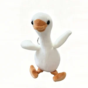 Söt vit gås och gul anka som mjuk plyschfigur, väskhänge och födelsedagspresent
