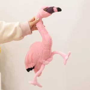Rosa flamingo gosedjur som tecknad plyschkudde och prydnadskudde med långa ben