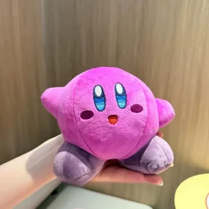 Samlarfigur i form av en orange Kirby-docka med arg min och tecknad spelstil 48 Samlarfigur i form av en orange Kirby-docka med arg min och tecknad spelstil