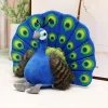 Blågrönt peacock gosedjur med utslagen solfjäderstjärt och kreativ utformning
