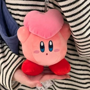 Samlarfigur i form av en orange Kirby-docka med arg min och tecknad spelstil 55 Samlarfigur i form av en orange Kirby-docka med arg min och tecknad spelstil
