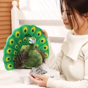 Blågrönt peacock gosedjur med utslagen solfjäderstjärt och kreativ utformning