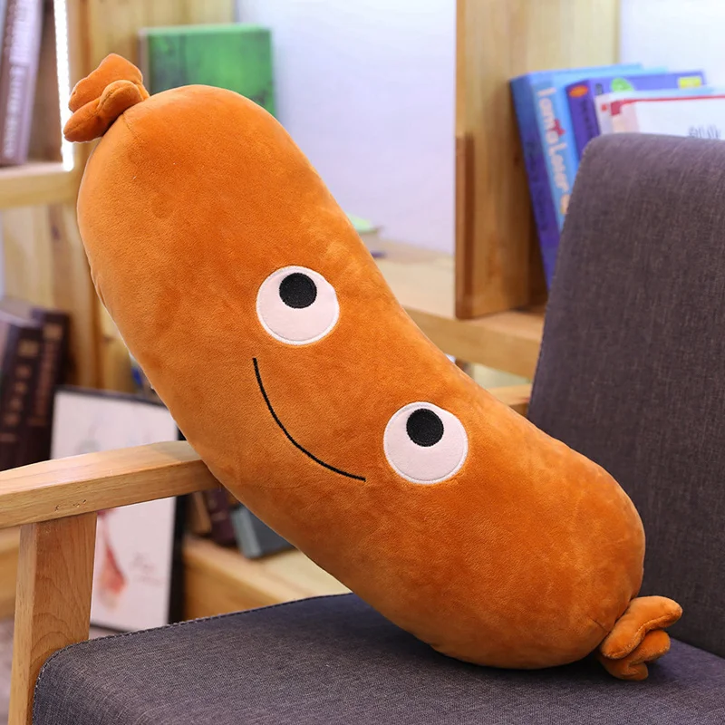 Kawaii-hundgosedjur i korvformad kudde med lekfullt snabbmatsmotiv och mjuk form 19 Visa ett orange korvformat gosedjur med broderat leende och små fötter.