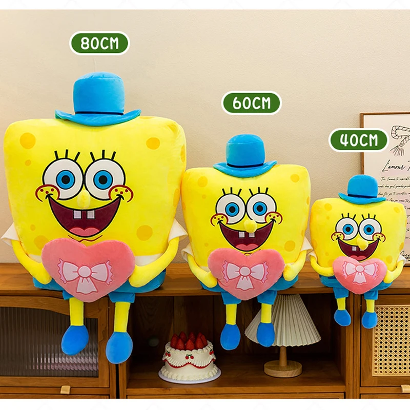 Patrick Star gosedjur som tecknad plyschkudde från SpongeBob SquarePants, 40–80 cm 24 Gula fyrkantiga plyschfigurer i tre storlekar, märkta 80, 60 och 40 cm.