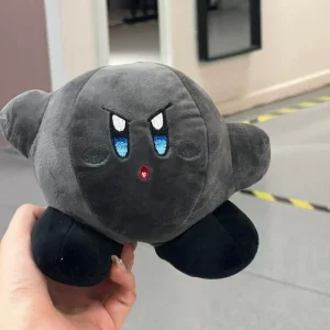 Samlarfigur i form av en orange Kirby-docka med arg min och tecknad spelstil 73 Samlarfigur i form av en orange Kirby-docka med arg min och tecknad spelstil