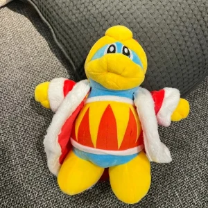 Samlarfigur i form av en orange Kirby-docka med arg min och tecknad spelstil 51 Samlarfigur i form av en orange Kirby-docka med arg min och tecknad spelstil